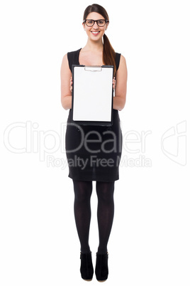 Business executive displaying blank clipboard