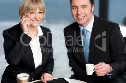 Business colleagues discussing work at break Business colleagues discussing work at break