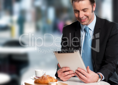 Handsome manager reviewing business updates
