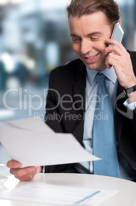 Businessman communicatng on phone