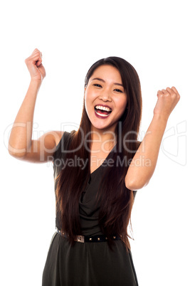 Excited woman with clenched fists