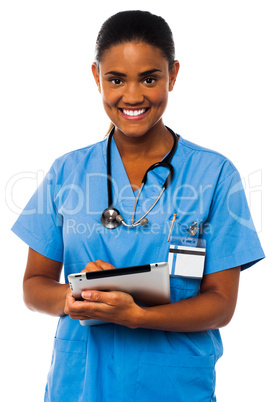 Female physician holding tablet pc