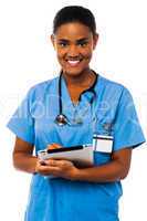 Female physician holding tablet pc