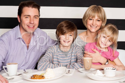 Family enjoying breakfast at restaurant