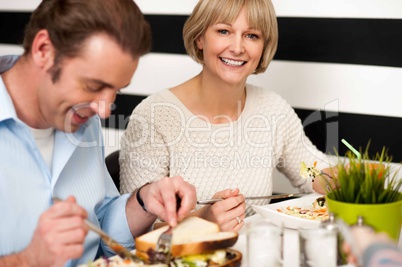 Couple enjoying breakfast in restaurant