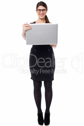 Smart businesswoman holding a laptop