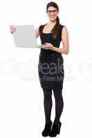 Smart corporate lady holding a laptop