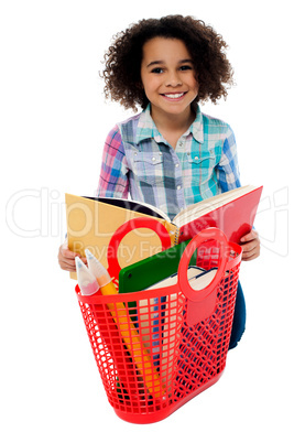 Elementary age school girl reading a book