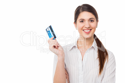 Smiling elegant woman holding credit card