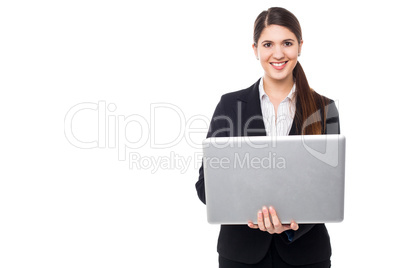 Attractive woman in formals working on laptop