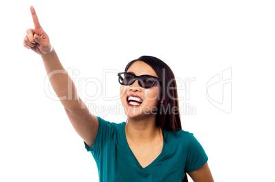 Jolly female model pointing at something Jolly female model pointing at something