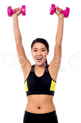 Female instructor showing how to lift dumbbells