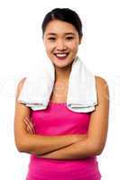 Fit smiling woman with towel around her neck