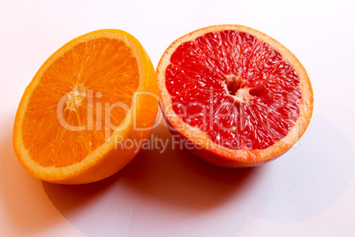 orange and grapefruit divided in half