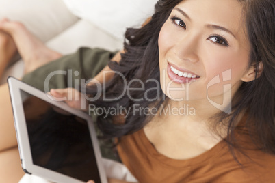 Beautiful Asian Chinese Woman Using Tablet Computer