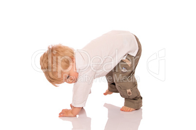 Young boy learning to walk