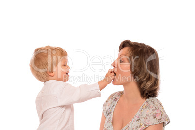 Young boy giving a candy to her mother