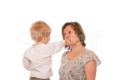 Young boy giving a candy to her mother