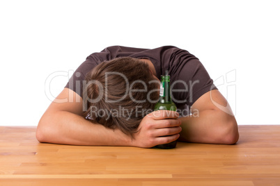 Man sleeping on a table with beer