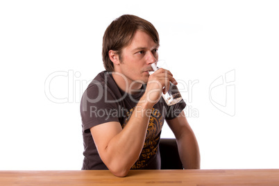 Man drinking water in a glass