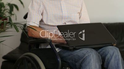 Businessman in wheelchair working