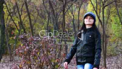 Teenager walking through the woods