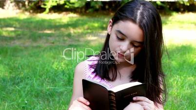 Young Girl reading Holy Bible