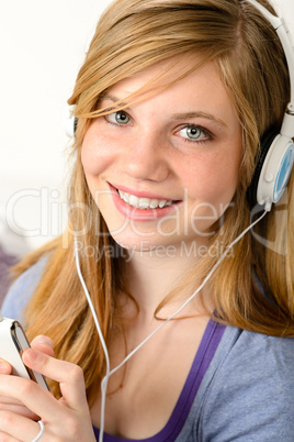 Portrait of a teenage girl listening music