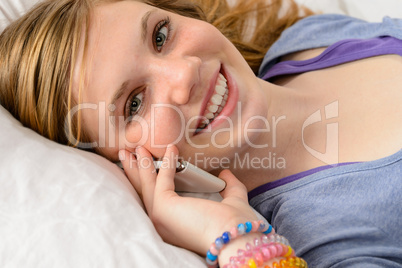 Portrait of teenager girl talking on phone