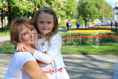 mother and daughter embrace