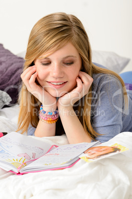 Friendly girl fantasizing over her diary