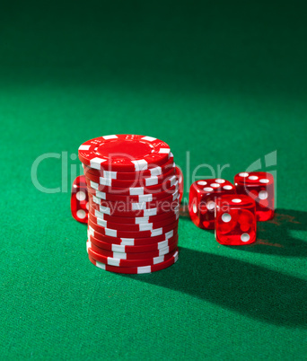 Red poker chips and red dice