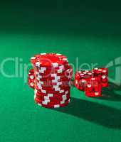 Red poker chips and red dice