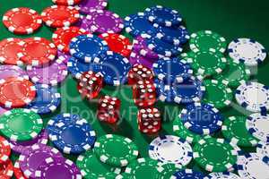 Colorful poker chips and red dice