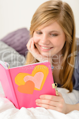 Young girl reading her journal of memories