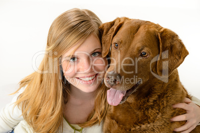 Cute  young girl holding a dog