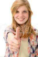 Young smiling girl showing thumbs up