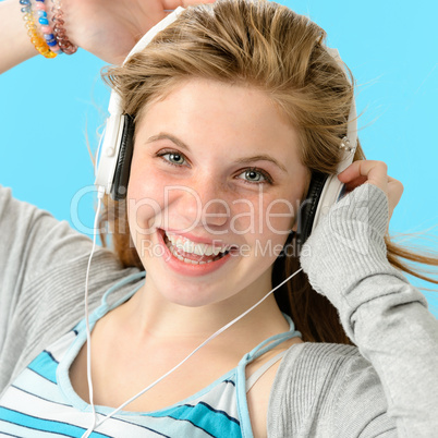 Carefree teenage girl dancing to music