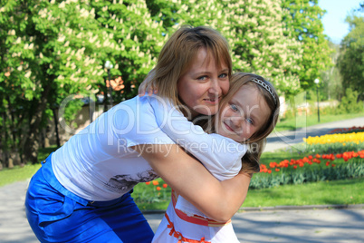 mother and daughter embrace