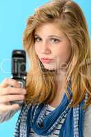 Young girl taking picture of herself