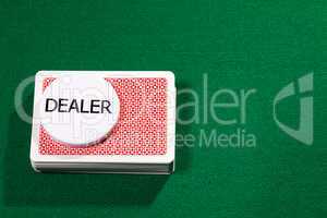 Poker cards with dealer chip