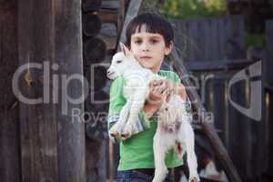 boy with little goat