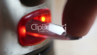 closeup pressing buttons of household appliances