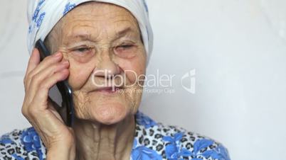 portrait of old woman talking on smartphone