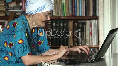 old woman using laptop