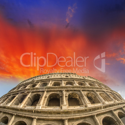 Beautiful sunset sky colors over Colosseum in Rome. Roma - Colos