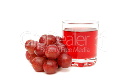 Glass with juice and grapes