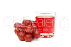 Glass with juice and grapes
