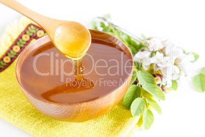 Honey in wooden bowl