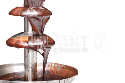 Chocolate fountain on white background